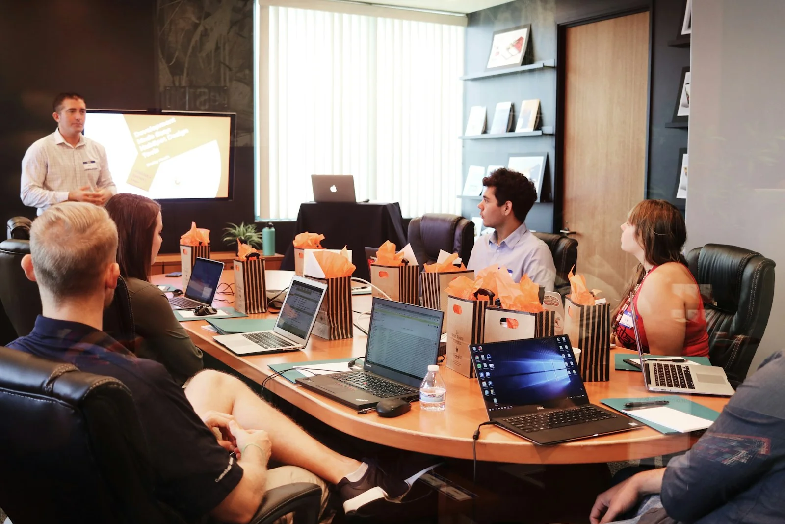 Business leadership and digital marketing agency experts collaborating on growth strategy and campaign performance in a modern boardroom