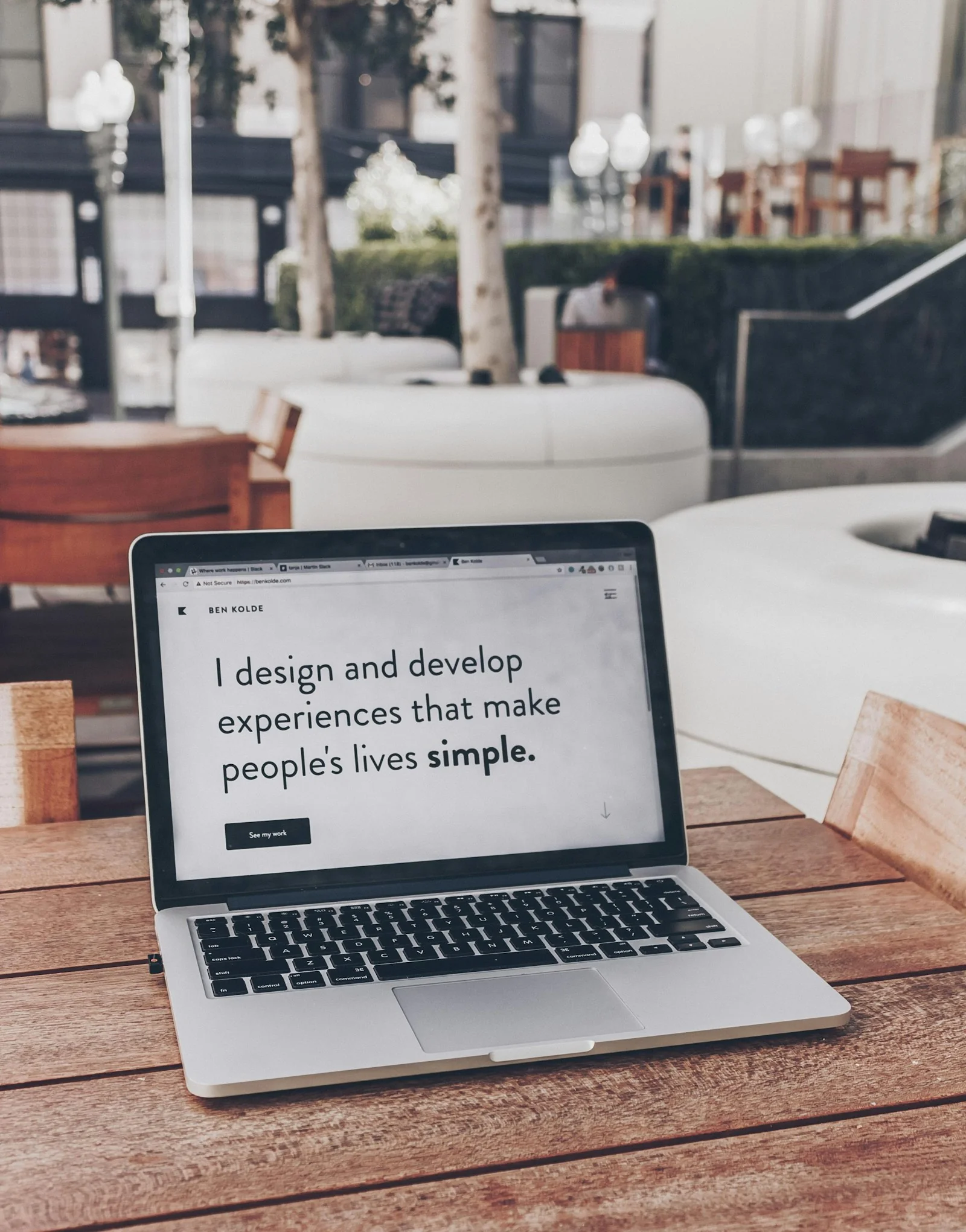 Professional website designer crafting modern high-performance web interfaces in a clean creative studio workspace